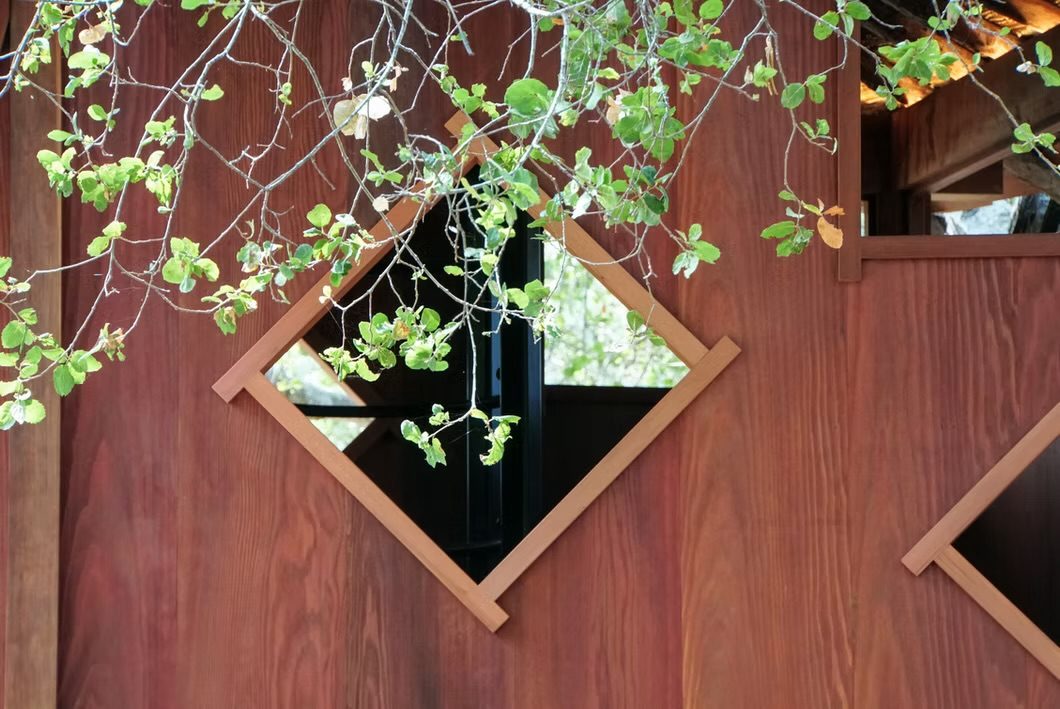 Diamond-shaped window in a redwood wall